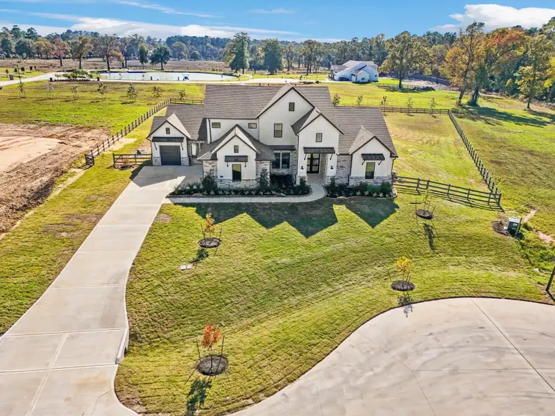 Front exterior of a new home in Bentwood Farms, Montgomery, TX, highlighting curb appeal (Image 2).