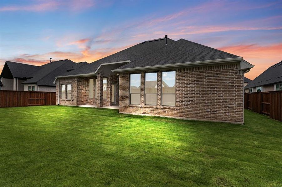 Front exterior of a new home in Windsong Ranch, Prosper, TX, highlighting curb appeal (Image 1). Front exterior of a new home in Windsong Ranch, Prosper, TX, highlighting curb appeal (Image 1).