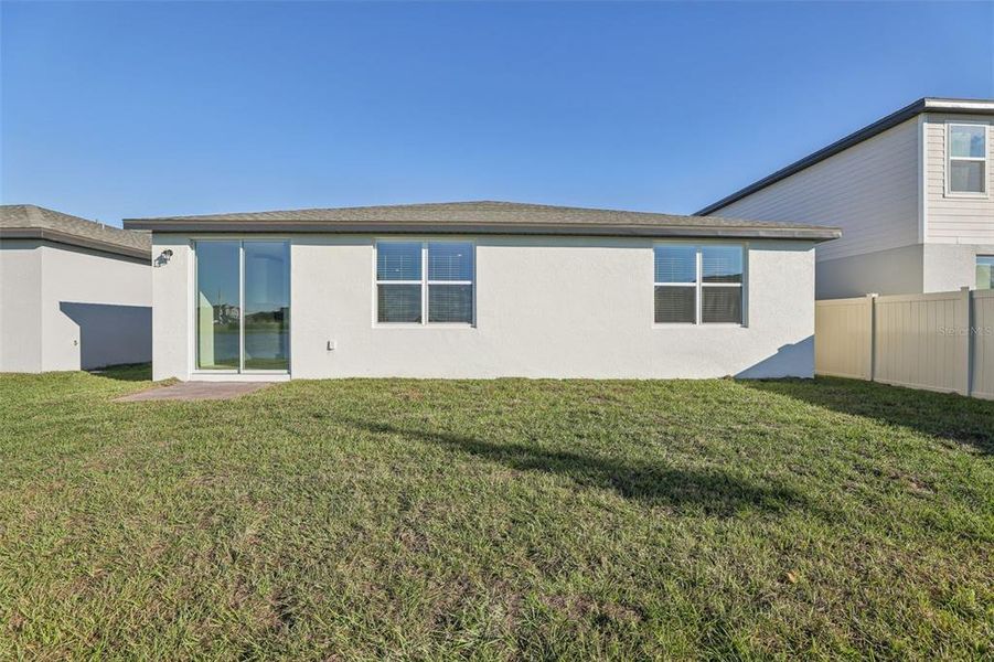 Exterior details and patio area of a home in Lake Deer Estates - Signature Series, Poinciana (Image 24).