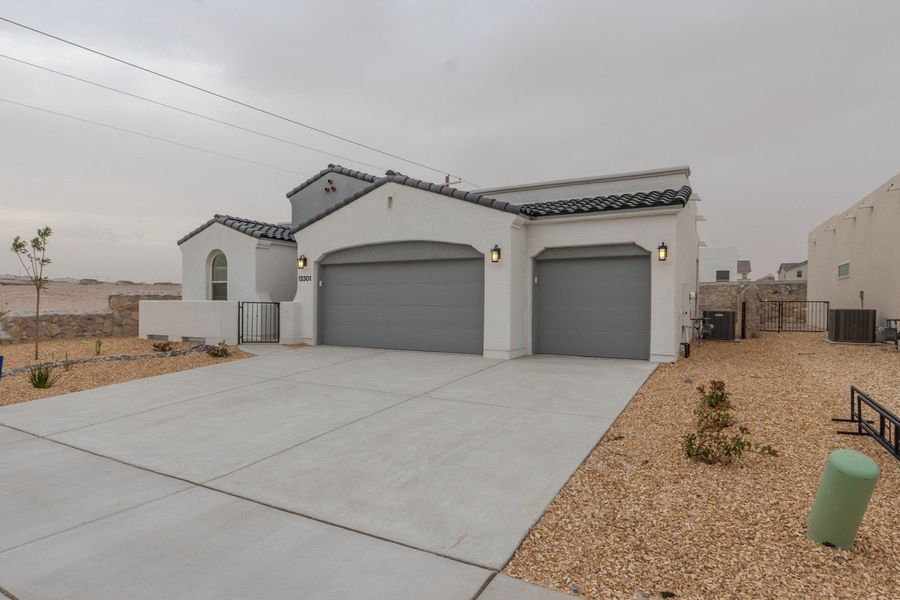 Front exterior of a new home in Emerald Estates, El Paso, TX, highlighting curb appeal (Image 2).