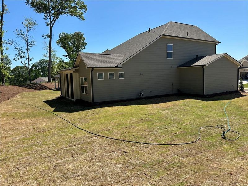 Exterior details and patio area of a home in Rosewood Lake Preserve, Hoschton (Image 24).
