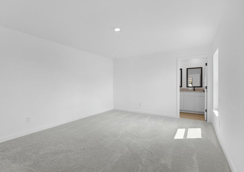 Rest and relaxation await in the master bedroom