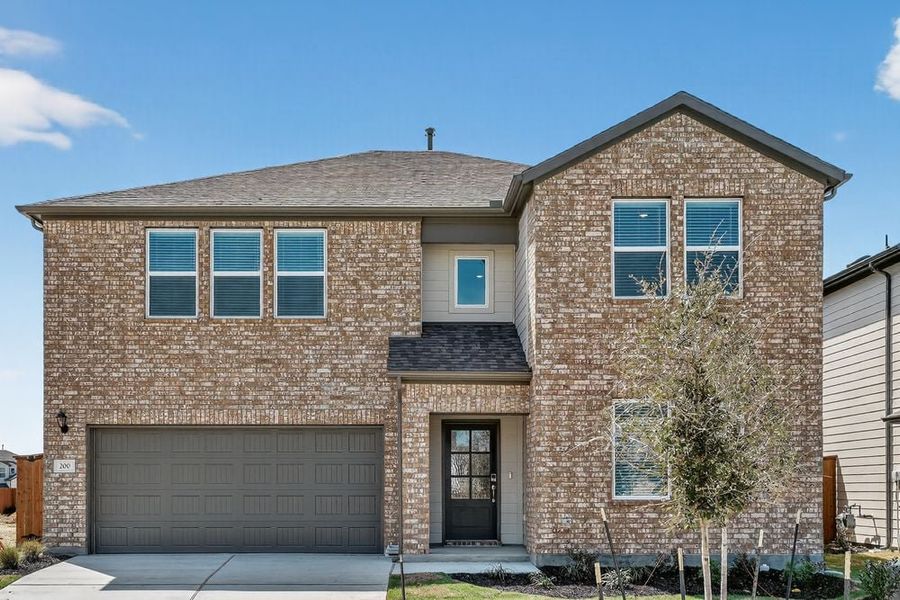 Representative exterior photo of a completed home built from the Wren by Taylor Morrison in Emory Crossing, Hutto, TX (Image 18).