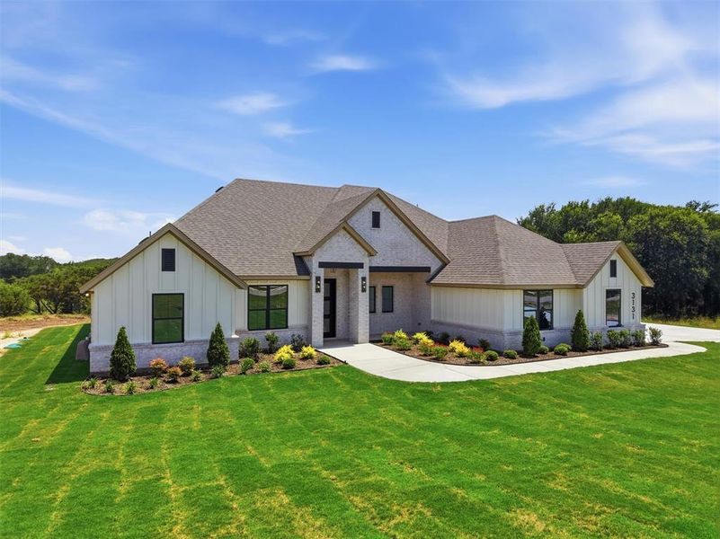 Front exterior of a new home in , Weatherford, TX, highlighting curb appeal (Image 22).