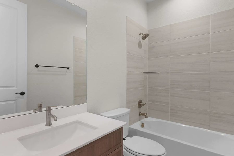 Representative furnished interior of a home built from the Brooks by Chesmar Homes in University Heights, McKinney (Image 5).
