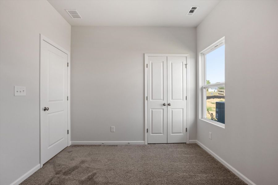 Spacious, unfurnished interior of a new home in Cambridge Reserve, Angier (Image 27).