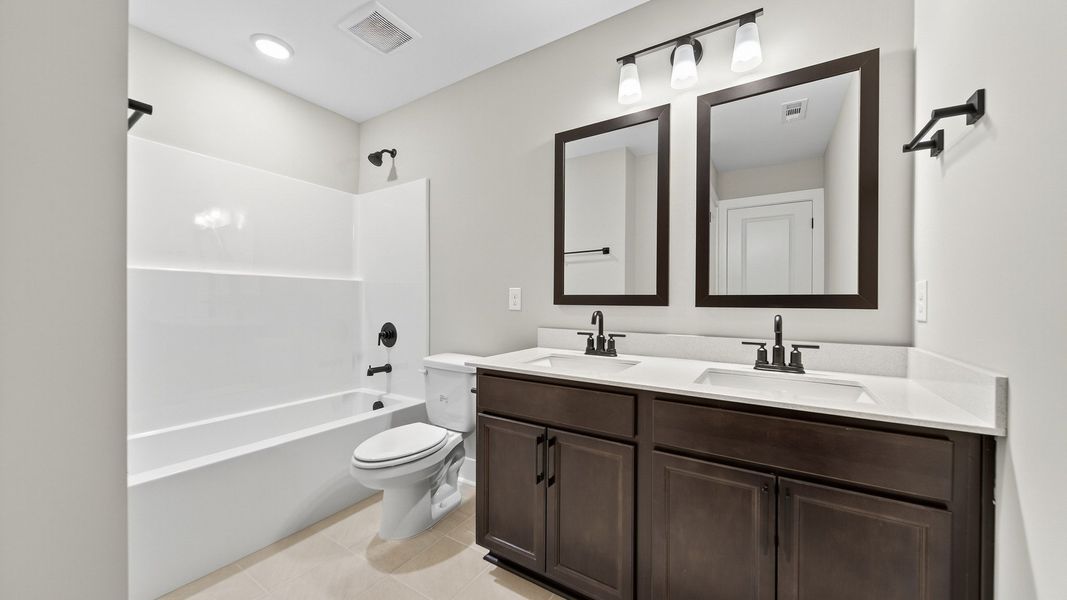 Furnished interior in a model home at McClure Farms in Columbia (Image 26).