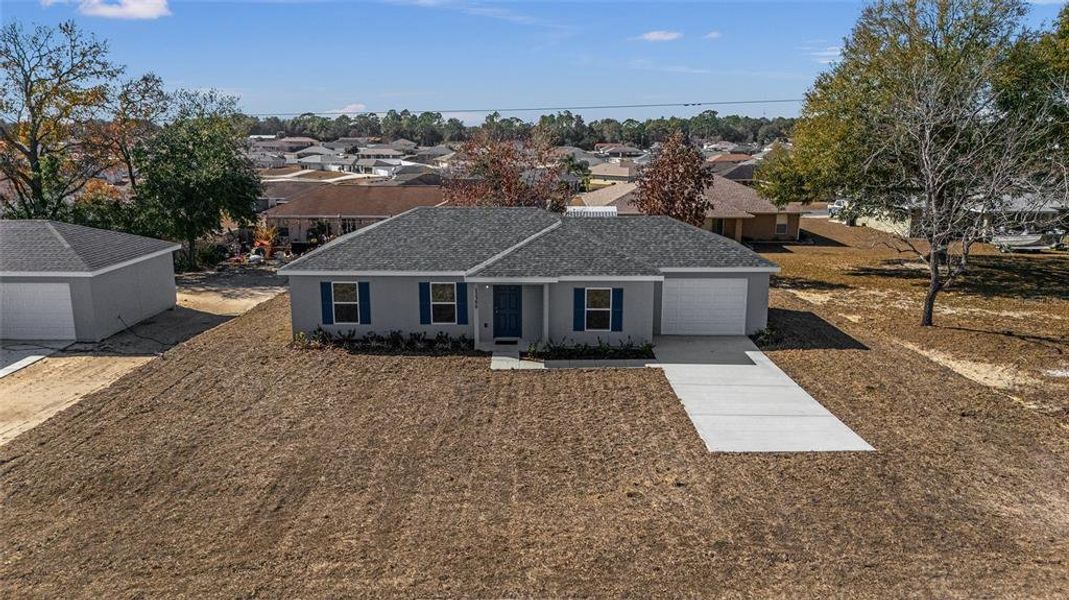 Front exterior of a new home in , Belleview, FL, highlighting curb appeal (Image 20).