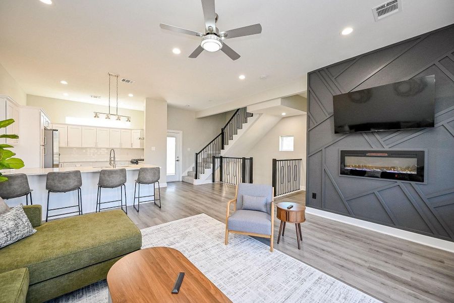 Spacious main living area with high ceilings and seamless flow to the kitchen.