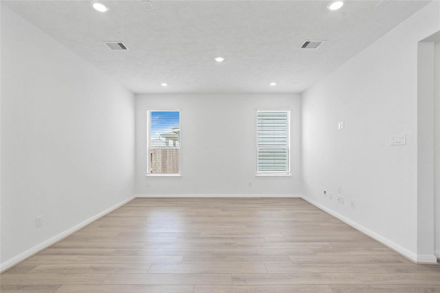 This light and bright living room is the perfect layout for entertaining or just relaxing. Whether it's simply a night in or entertaining family and friends, this home has ample open space for everyone to enjoy! Featuring vinyl plank flooring, large windows with blinds and recessed lighting with wonderful access to your gorgeous kitchen. This light and bright living room is the perfect layout for entertaining or just relaxing. Whether it's simply a night in or entertaining family and friends, this home has ample open space for everyone to enjoy! Featuring vinyl plank flooring, large windows with blinds and recessed lighting with wonderful access to your gorgeous kitchen.