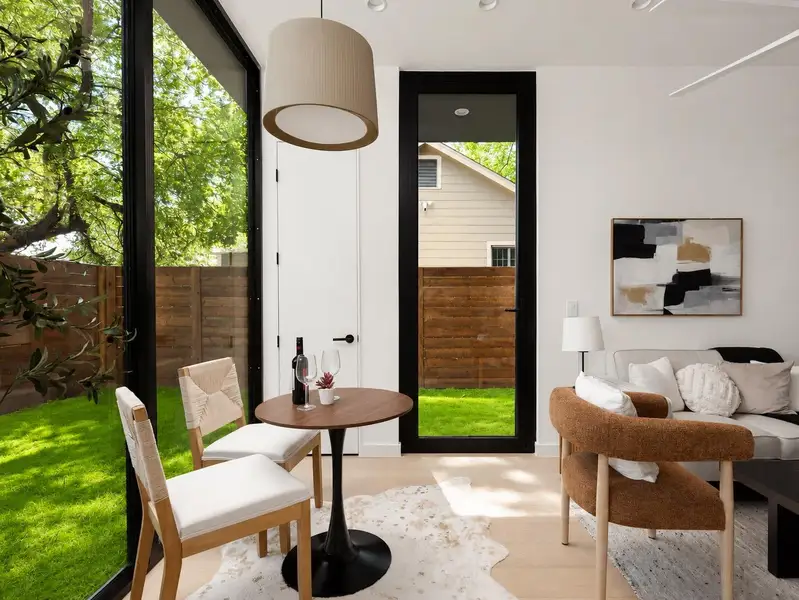 Natural light floods this living area, offering a seamless connection to the private outdoor space. Natural light floods this living area, offering a seamless connection to the private outdoor space.