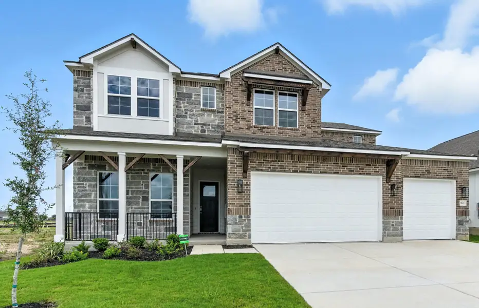 Front exterior of a new home in Weltner Farms 60’s, New Braunfels, TX, highlighting curb appeal (Image 1).