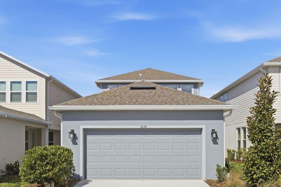 Front exterior of a new home in Center Lake Ranch Community Group Page, St. Cloud, FL, highlighting curb appeal (Image 19).