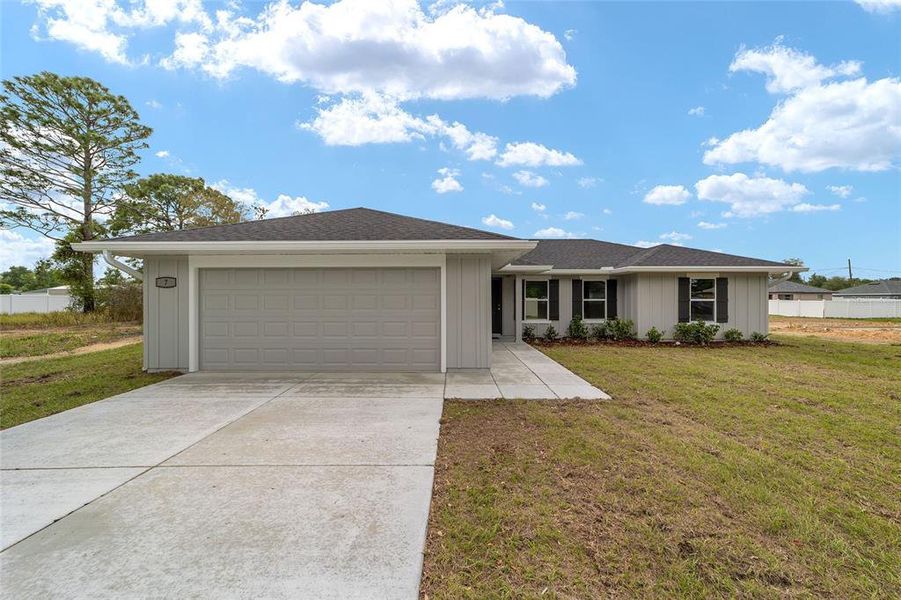 Front exterior of a new home in , Ocala, FL, highlighting curb appeal (Image 22).