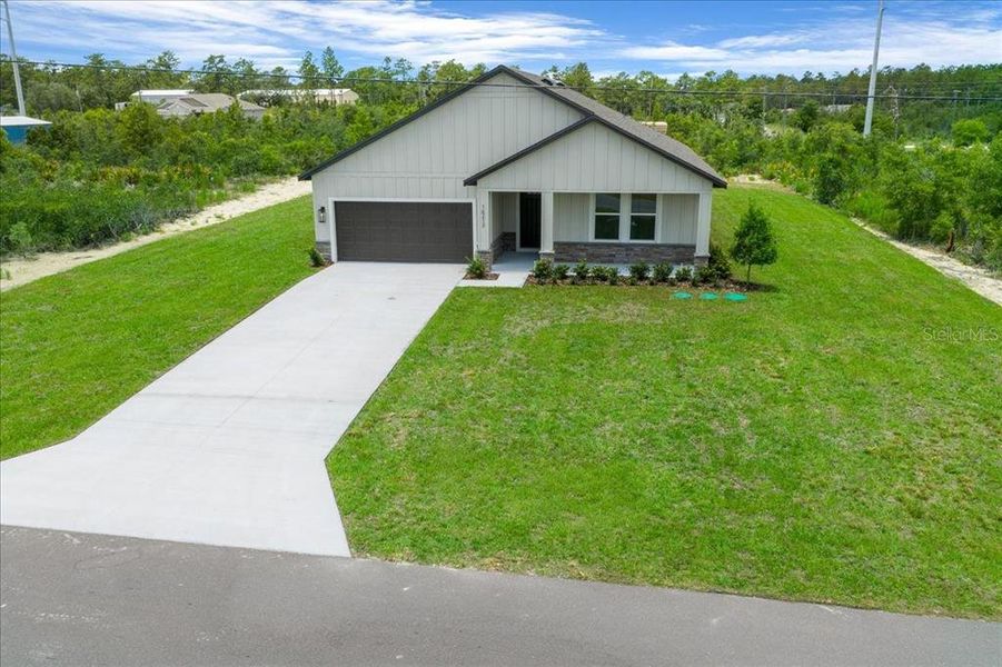 Front exterior of a new home in , Weeki Wachee, FL, highlighting curb appeal (Image 1). Front exterior of a new home in , Weeki Wachee, FL, highlighting curb appeal (Image 1).