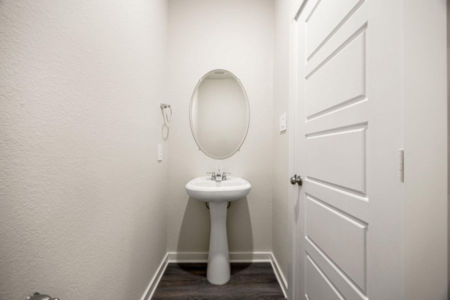 Perfectly situated on the main level for guests, this powder room is a welcome convenience. Perfectly situated on the main level for guests, this powder room is a welcome convenience.