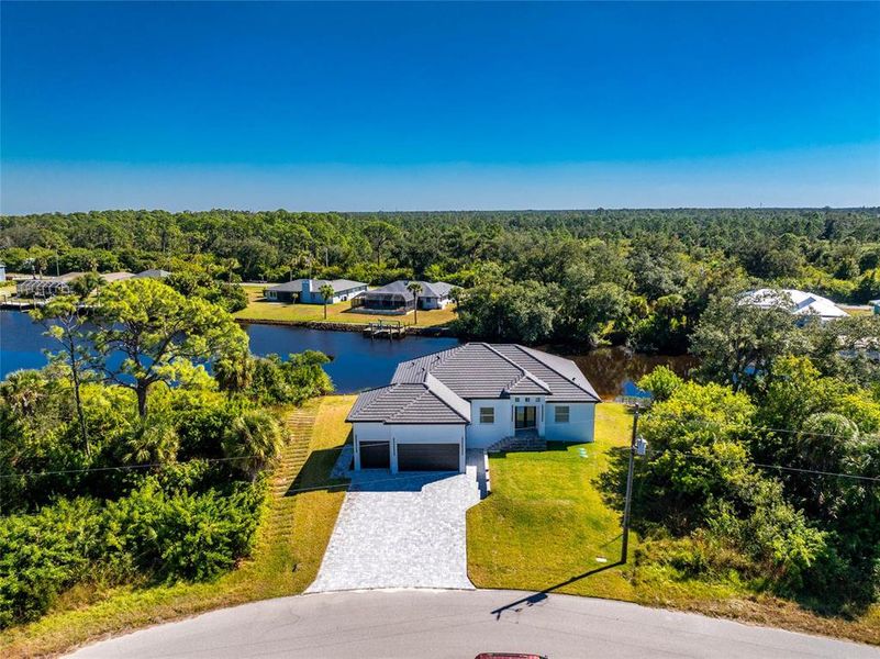 Front exterior of a new home in , Port Charlotte, FL, highlighting curb appeal (Image 30). Front exterior of a new home in , Port Charlotte, FL, highlighting curb appeal (Image 30).