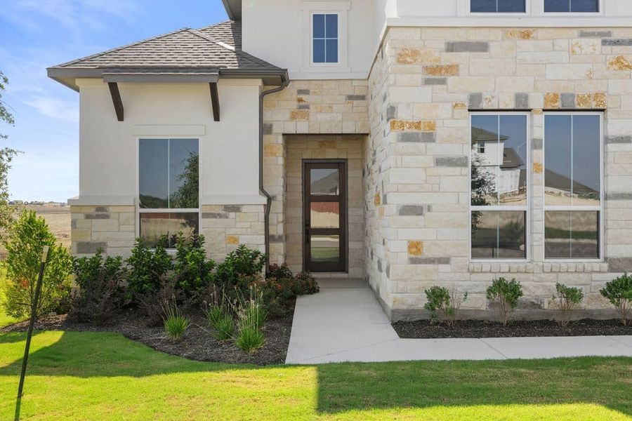 Exterior details and patio area of a home in Lariat, Liberty Hill (Image 3).