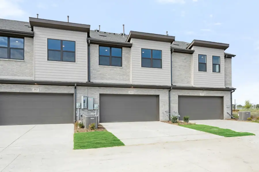 Front exterior of a new home in Ten Mile Creek, Celina, TX, highlighting curb appeal (Image 27).