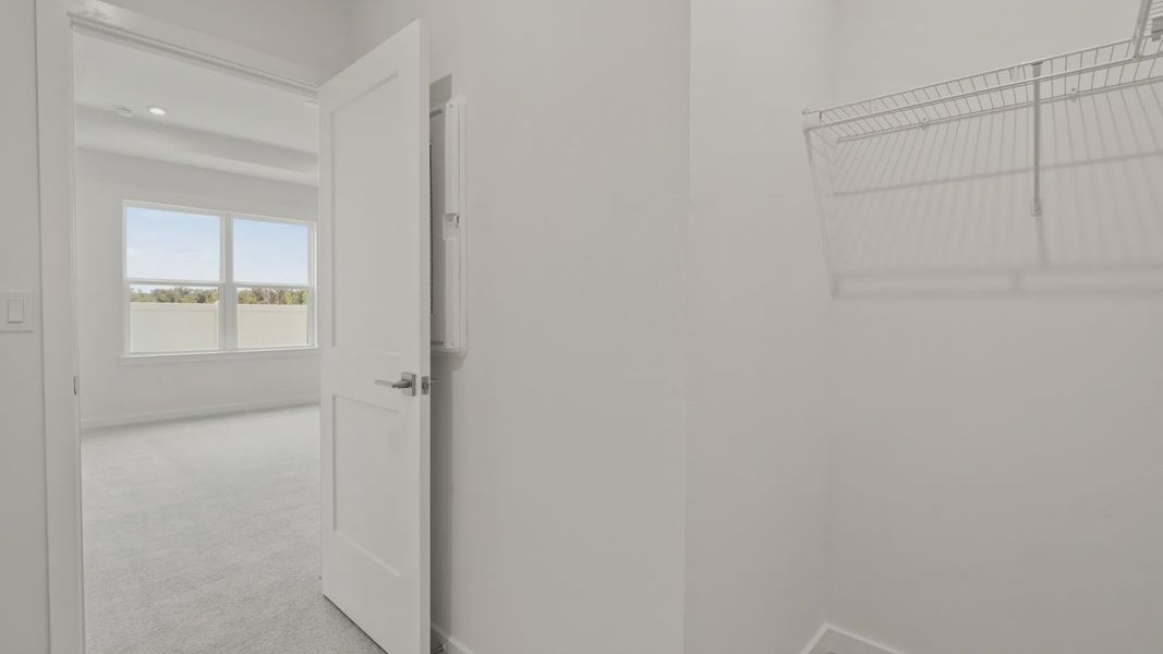 The Flagler Floorplan at Grasslands West new home in Lakeland, FL Showcasing the primary bedroom closet.