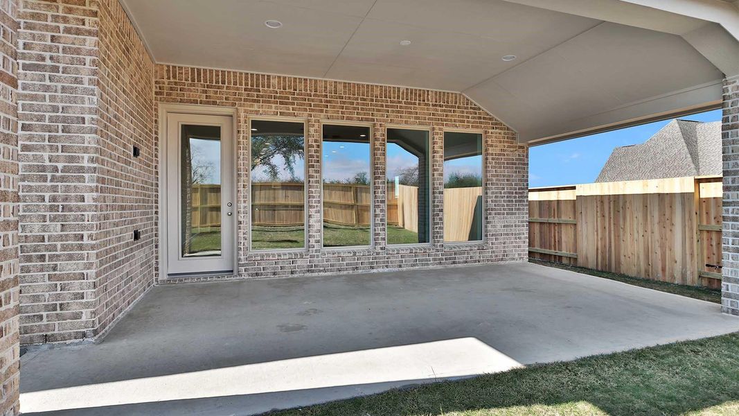 Exterior details and patio area of a home in Meridiana, Manvel (Image 3).