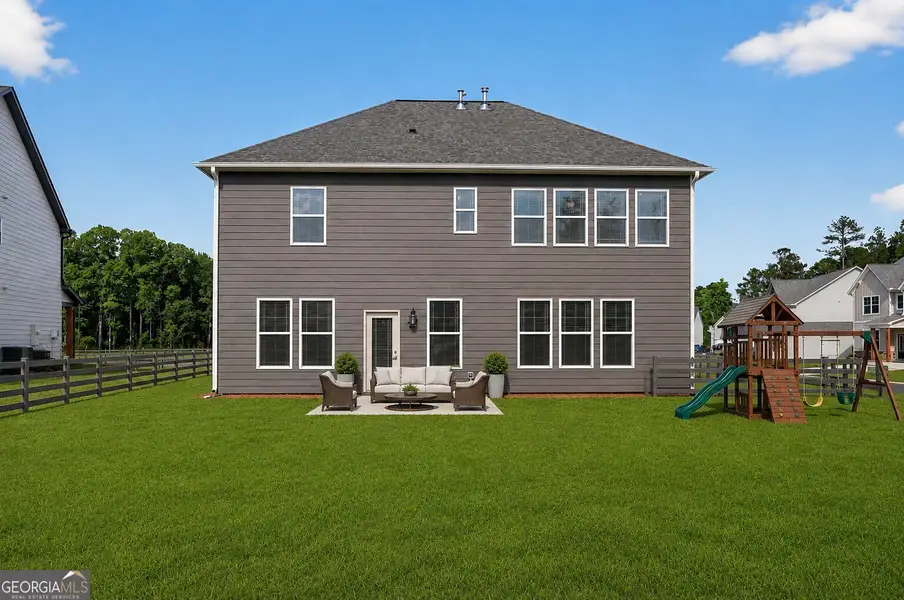 Exterior details and patio area of a home in The Fairways at Mirror Lake, Villa Rica (Image 4).