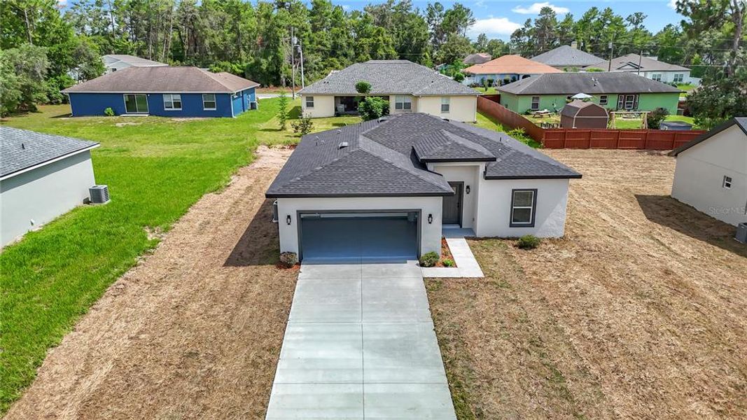 Front exterior of a new home in , Ocala, FL, highlighting curb appeal (Image 21).