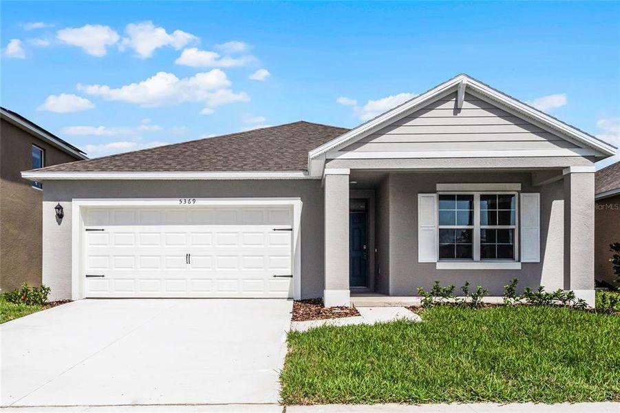 Front exterior of a new home in Crossroads at Kelly Park, Apopka, FL, highlighting curb appeal (Image 1). Front exterior of a new home in Crossroads at Kelly Park, Apopka, FL, highlighting curb appeal (Image 1).