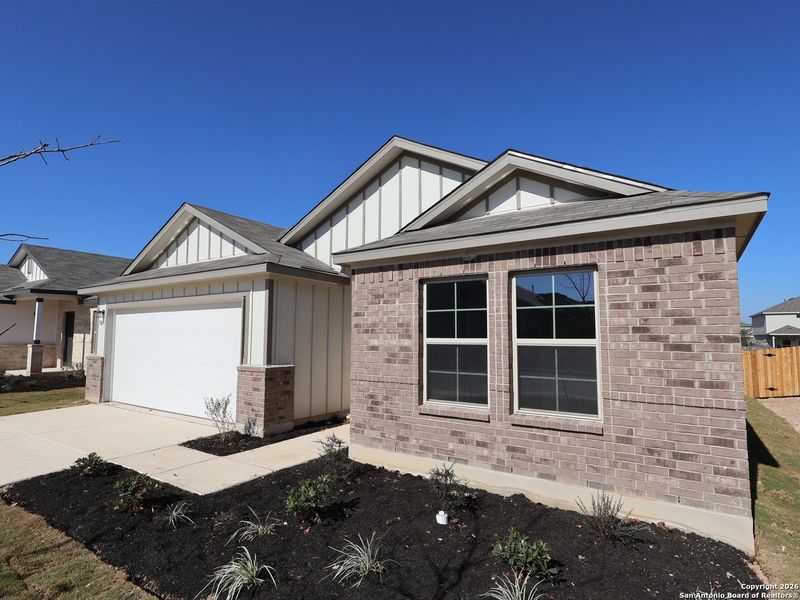 Front exterior of a new home in Winding Brook, San Antonio, TX, highlighting curb appeal (Image 18).
