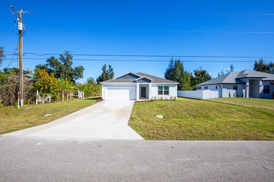 Front exterior of a new home in Cape Coral, Cape Coral, FL, highlighting curb appeal (Image 17).