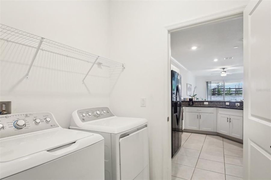 Laundry room with view of the kitchen. Laundry room with view of the kitchen.