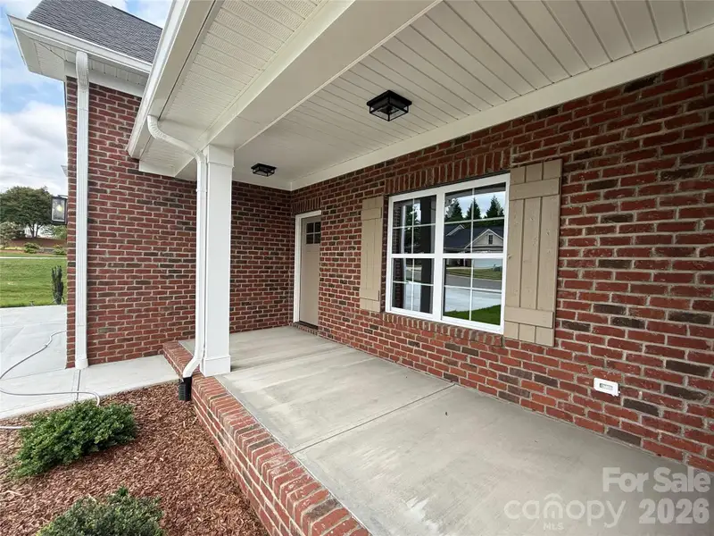 Beautiful shutters and front door and plenty of room for seating