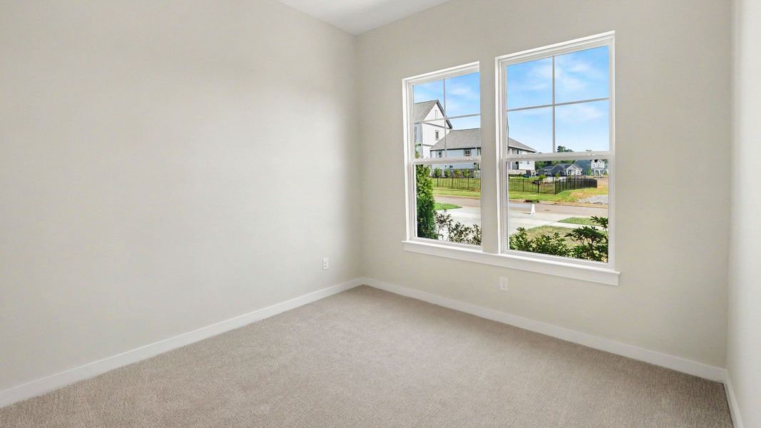 Bedroom located on the first floor at the front of the home