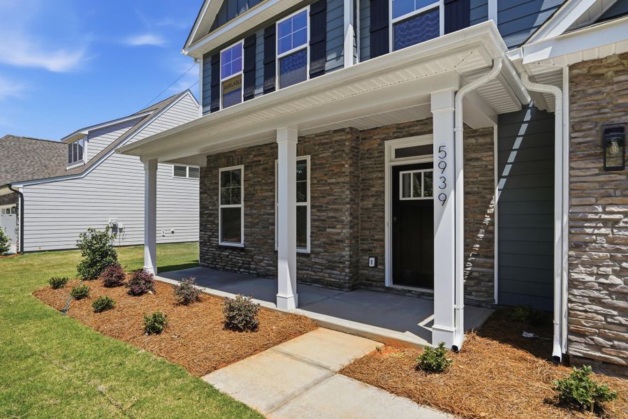 Exterior details and patio area of a home in Enclave at Riverdale, Huntersville (Image 3).