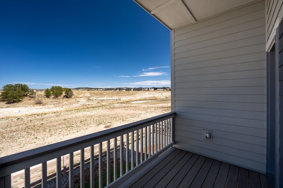 Exterior details and patio area of a home in Revel Crossing at Wolf Ranch - The Panorama Collection, Colorado Springs (Image 3).