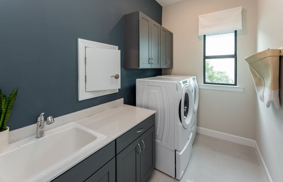 Laundry room with ample storage spaces Laundry room with ample storage spaces