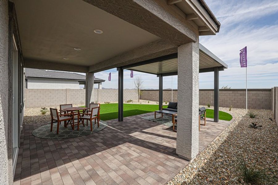 A patio with a table and chairs. A patio with a table and chairs.