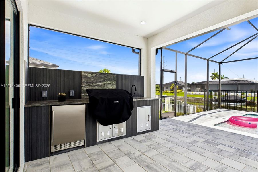 FULLY EQUIPED OUTDOOR KITCHEN w/ BUILT-IN stainless steel BBQ GRILL, SINK, BEVERAGE REFRIGERATOR, GRANITE COUNTERTOPS & MODERN BACKSPLASH! FULLY EQUIPED OUTDOOR KITCHEN w/ BUILT-IN stainless steel BBQ GRILL, SINK, BEVERAGE REFRIGERATOR, GRANITE COUNTERTOPS & MODERN BACKSPLASH!
