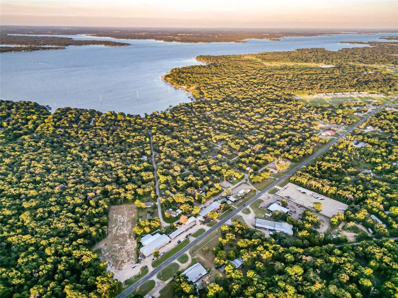 Aerial view at dusk of a water view and a residential view Aerial view at dusk of a water view and a residential view