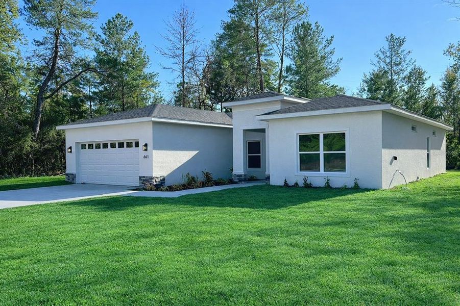 Front exterior of a new home in , Ocala, FL, highlighting curb appeal (Image 22).
