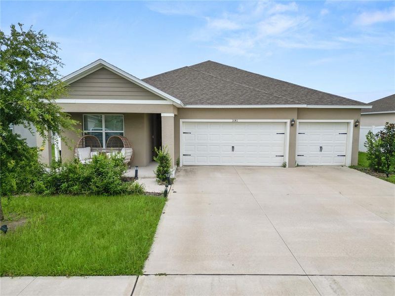 Front exterior of a new home in Wind Meadows South, Bartow, FL, highlighting curb appeal (Image 2). Front exterior of a new home in Wind Meadows South, Bartow, FL, highlighting curb appeal (Image 2).