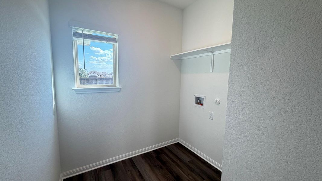 A dedicated utility space with a window offers a practical and organized area for household chores. A dedicated utility space with a window offers a practical and organized area for household chores.