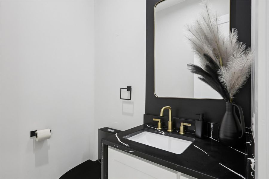 Half bath with vanity and toilet