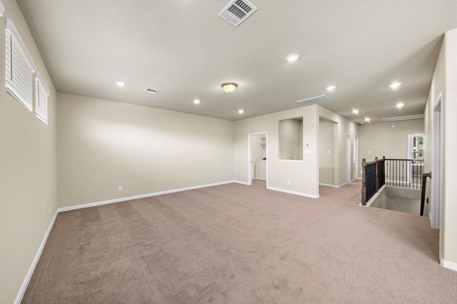 This generously sized game room provides ample space for entertainment, whether it’s a game night with friends or a cozy movie marathon. This generously sized game room provides ample space for entertainment, whether it’s a game night with friends or a cozy movie marathon.
