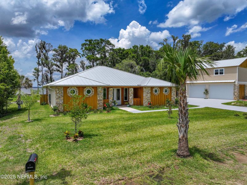 Front exterior of a new home in , East Palatka, FL, highlighting curb appeal (Image 34). Front exterior of a new home in , East Palatka, FL, highlighting curb appeal (Image 34).