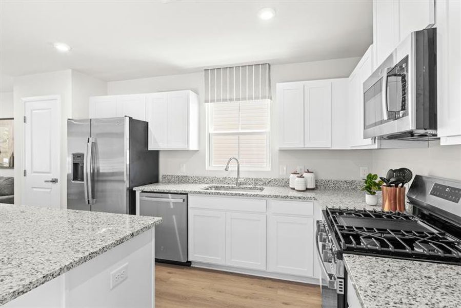 Representative furnished interior of a home built from the Reese by Ryan Homes in Middle Creek Village Coastal Cottages & Villas, Bolivia (Image 6).