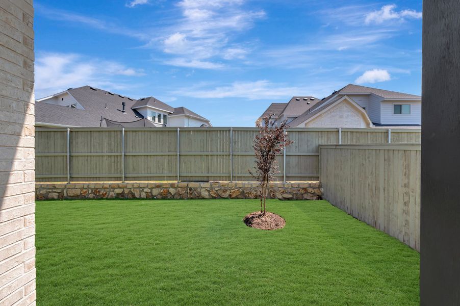Exterior details and patio area of a home in Pecan Square - Gardens, Northlake (Image 4).