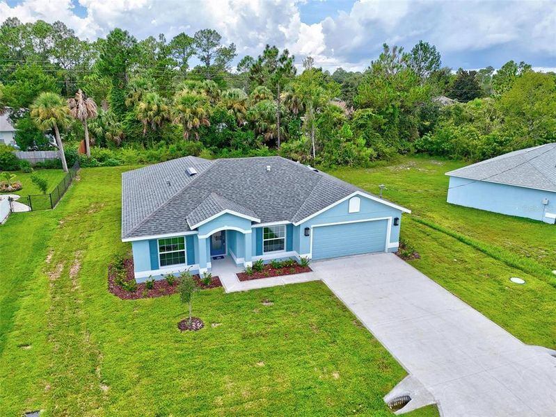 Front exterior of a new home in , Palm Coast, FL, highlighting curb appeal (Image 31).