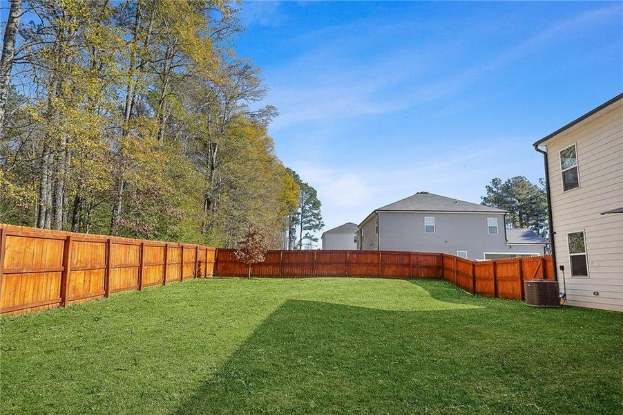 Exterior details and patio area of a home in The Greens at Thompson Creek, Hampton (Image 27).
