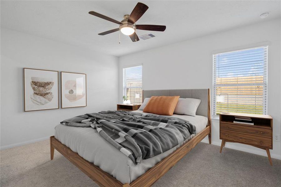 Come and unwind after a long day in this magnificent primary suite! This spacious room features plush carpet, warm paint, high ceilings with ceiling fan, and large windows with privacy blinds.